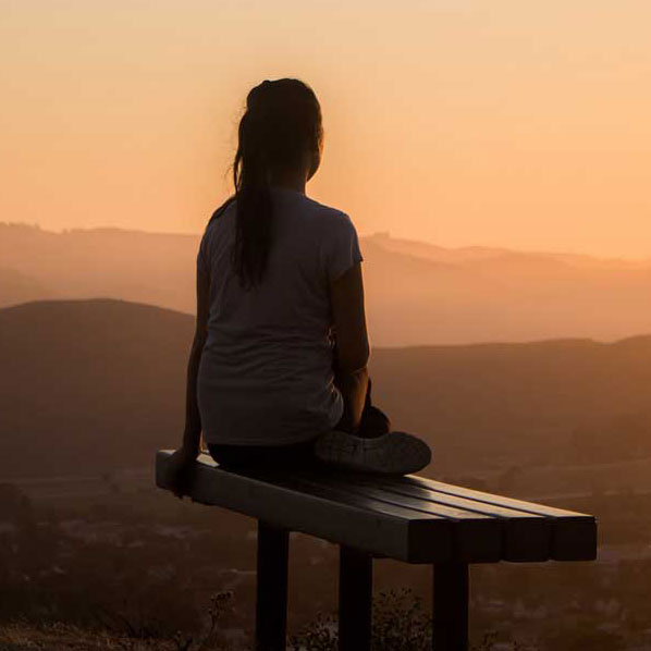 Person sitting in nature thinking