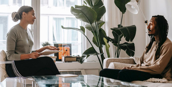 A Therapist Talking to a Patient